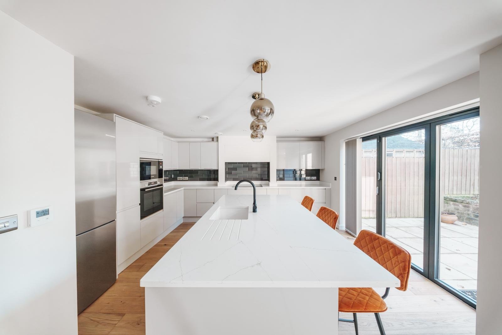 Contemporary kitchen island & downlighting